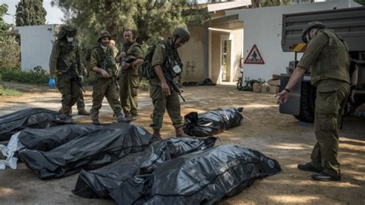 Woman whose body was paraded naked, spat on by Hamas militants identified as German tourist – India TV