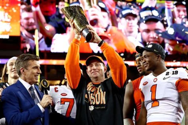 Tony Khan Presents AEW World Title to Clemson Tigers After Gator Bowl Win