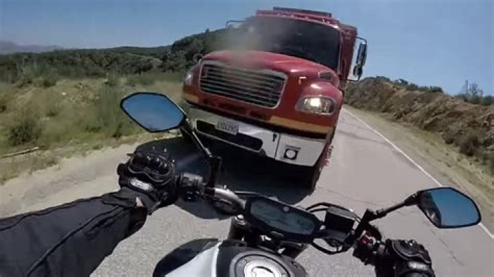 Watch Motorcyclist, GoPro Survive Head-On Collision With Truck