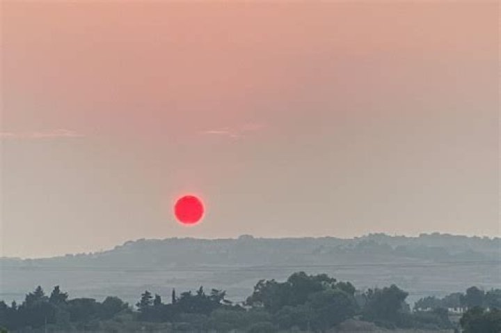 Why Is The Sun So Surprisingly Bright Red?
